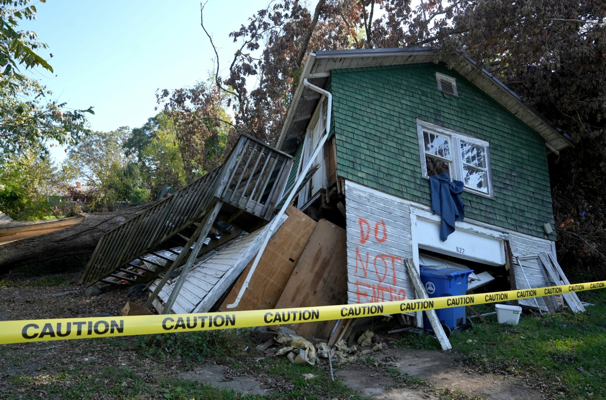 2024-10-08T221432Z_1063039021_MT1USATODAY24439331_RTRMADP_3_A-HOUSE-SITS-DAMAGED-ON-OCT-8-2024-IN-ASHEVILLE-NC-scaled